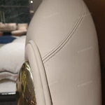 Beige Leather Upholstered Bed with Gold Stainless Steel Elephant Head Accents & Hammered Base Trim